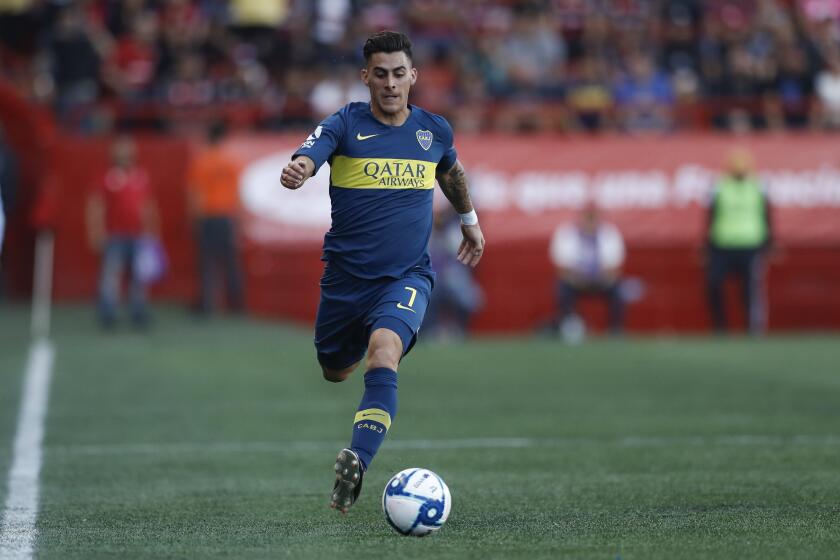 Boca Juniors's Cristian Pavon during the first half of a friendly soccer match against Tijuana Wednesday, July 10, 2019, in Tijuana, Mexico. (AP Photo/Gregory Bull)