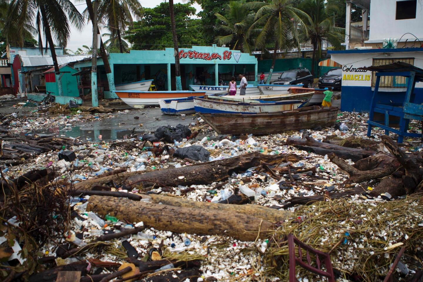 Debris litters the coastline of Santo Domingo, near the Port of Haina, on Oct. 3, 2016 as strong winds and rain from Hurricane Matthew hit the Dominican Republic.