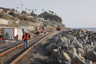 San Clemente, CA - November 28: South of San Clemente State Beach railroad and bluff repairs occur below the Cypress Cove development at upper left. (Charlie Neuman / For The San Diego Union-Tribune)