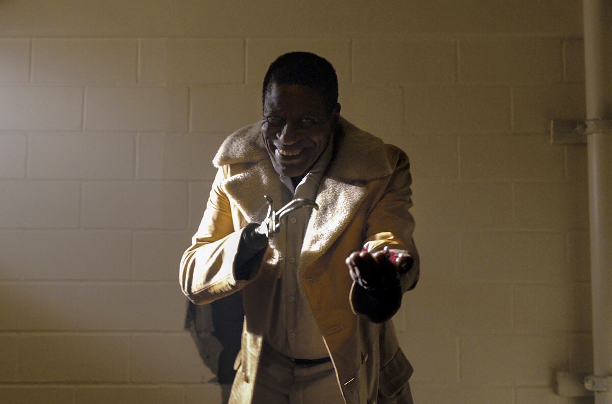 A man with a prosthetic hand in the movie "Candyman."