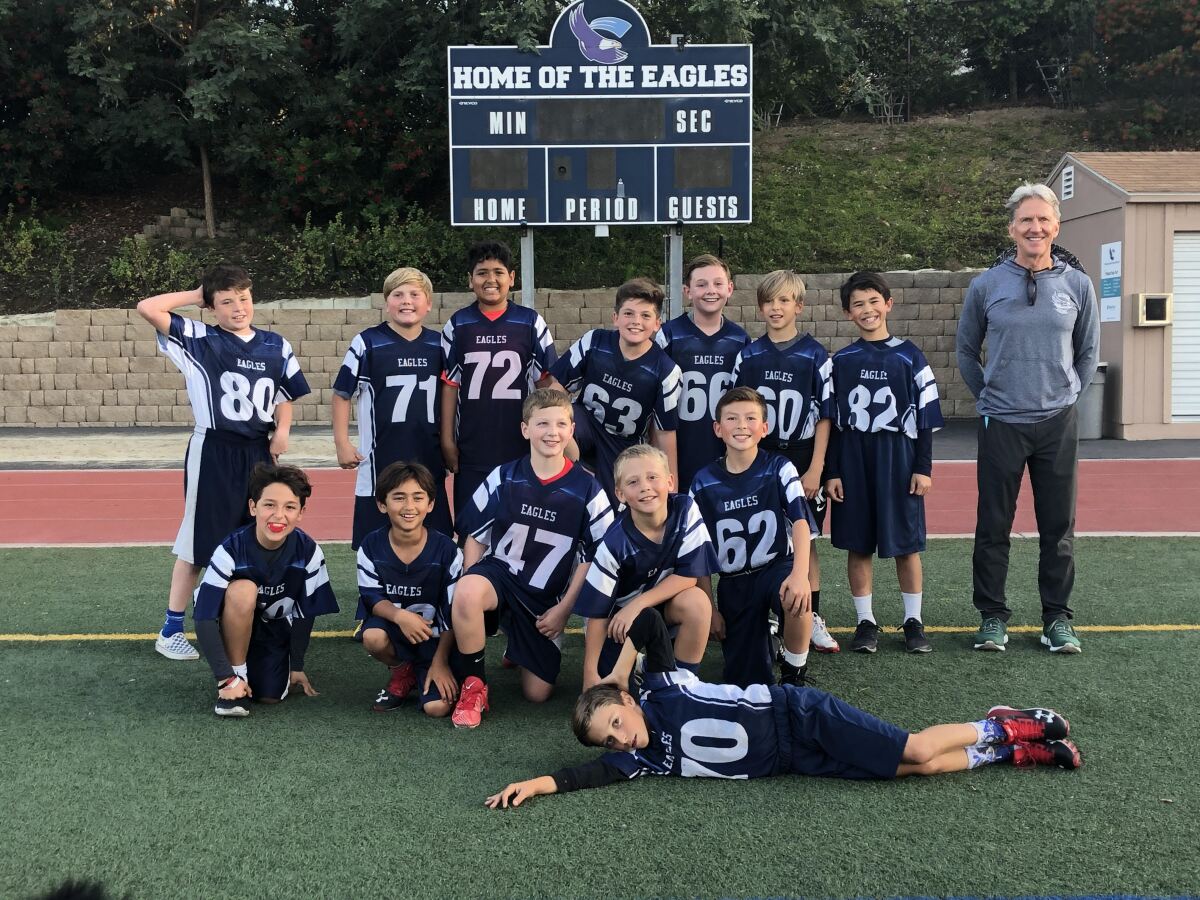 The undefeated R. Roger Rowe School fifth grade football team.