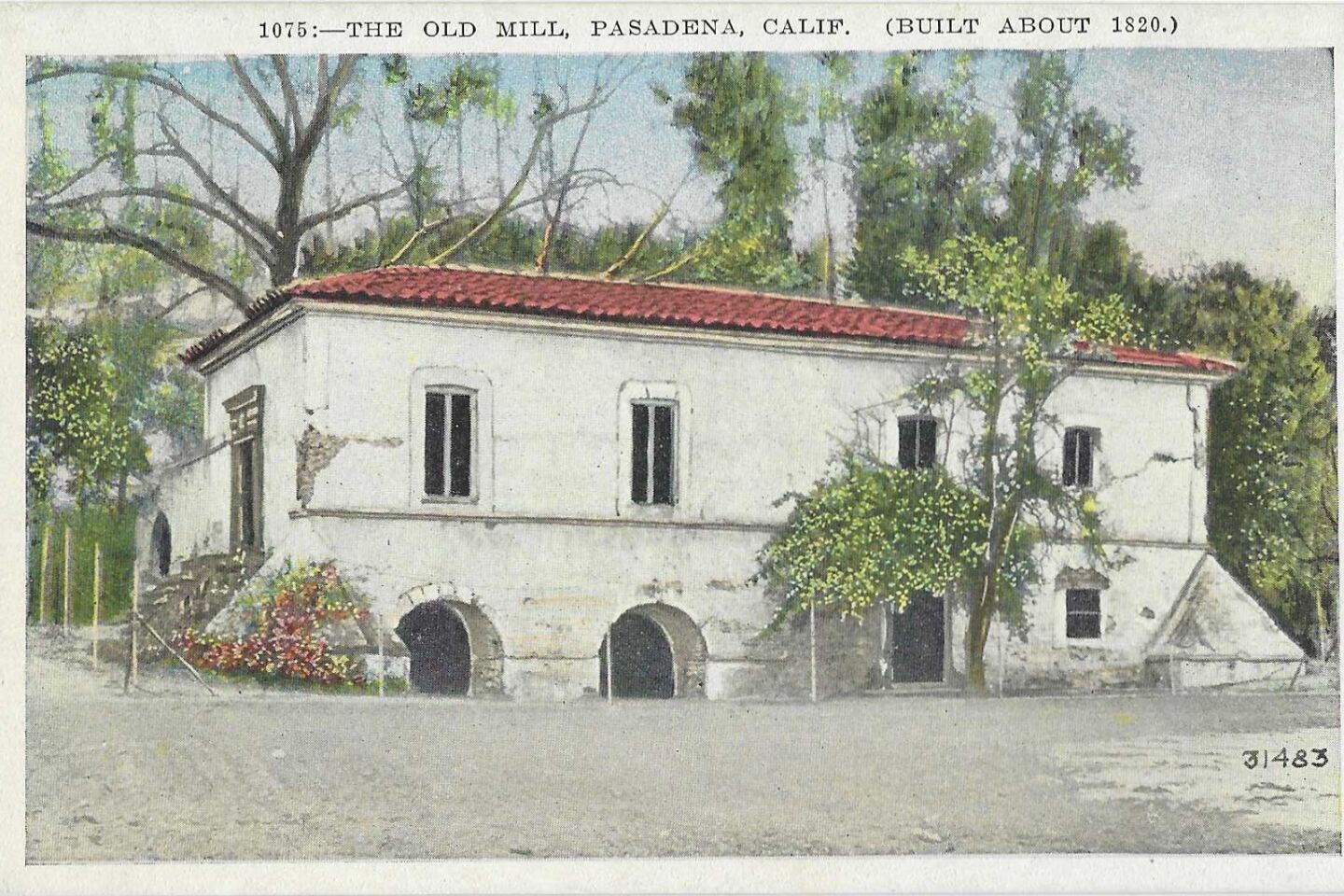 The front of a postcard depicting the Old Mill in present-day San Marino