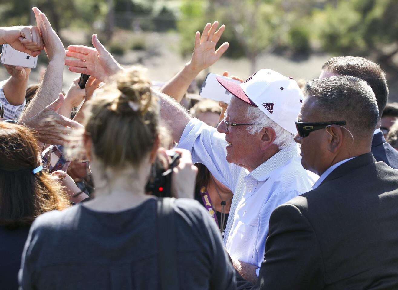 Democratic presidential candidate Bernie Sanders shakes hands with supporters after speaking at Rancho Buena Vista High School in Vista.