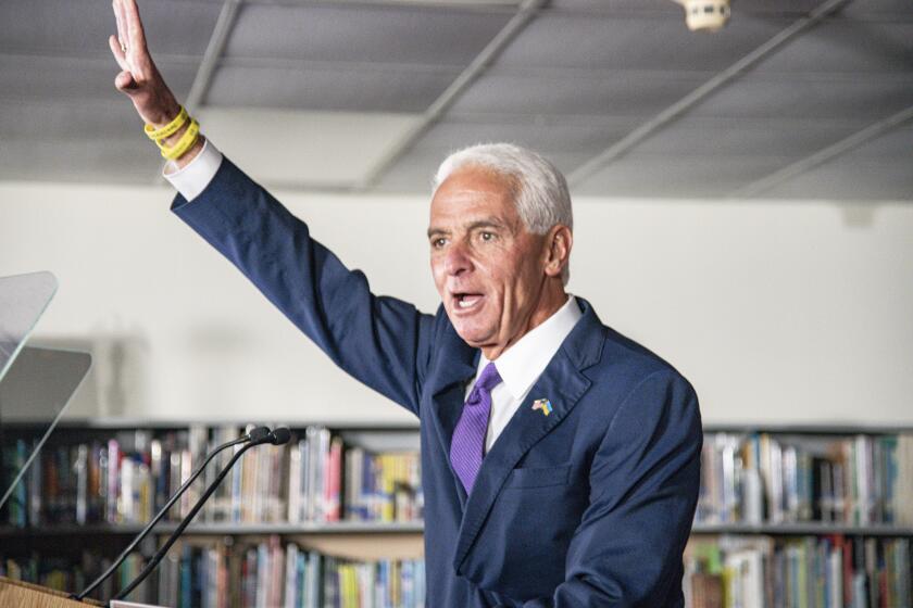 U.S. Rep. Charlie Crist speaks to supporters as he announces his running mate Karla Hernández-Mats at Hialeah Middle School in Hialeah, Fla., Saturday Aug. 27, 2022 as he challenges Republican Gov. Ron DeSantis in November (AP Photo/Gaston De Cardenas)