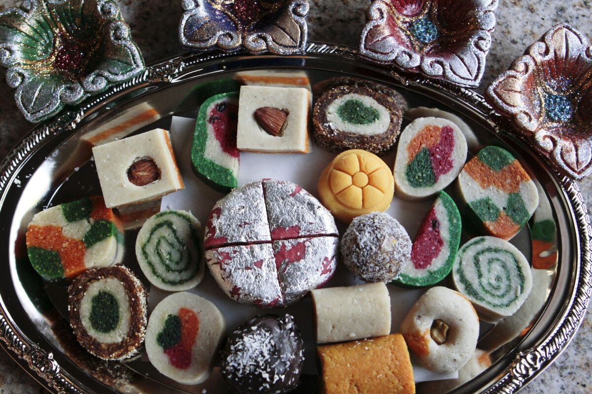 A variety of sweets are sold at Surati Farsan Mart restaurant in Artesia, CA.