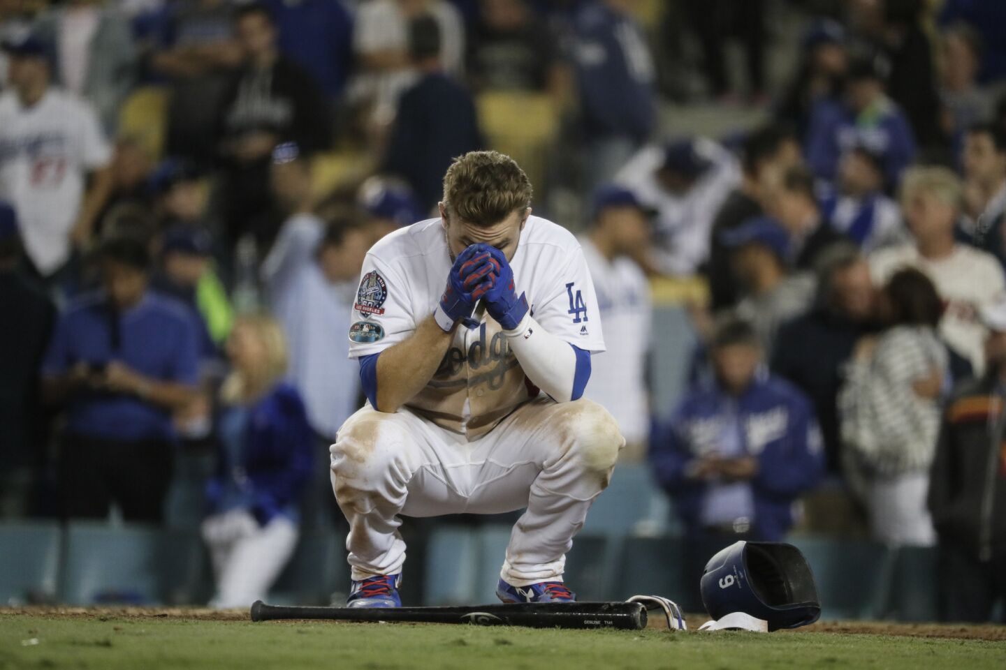 Dodgers Brian Dozier is upset after striking out in the bottom of the 10th inning.