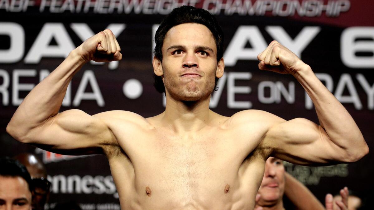 Julio Cesar Chavez Jr. flexes during his weigh-in on Friday at the MGM Grand in Las Vegas.