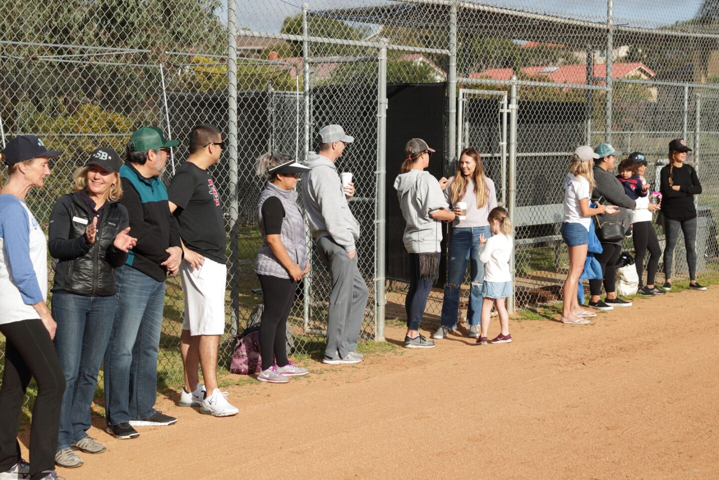 Parents watch the parade of teams