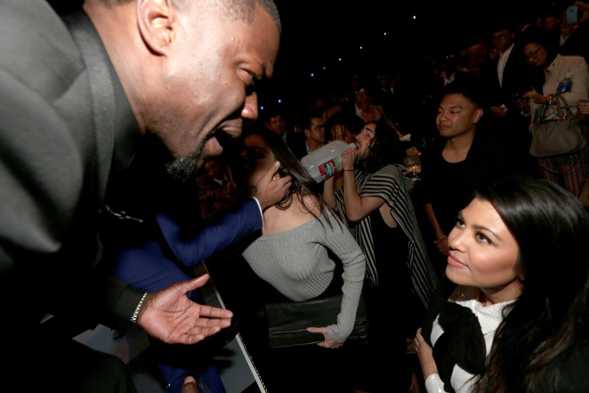 Kourtney Kardashian engages with Kevin Hart at the Comedy Central Roast of Justin Bieber on March 14.