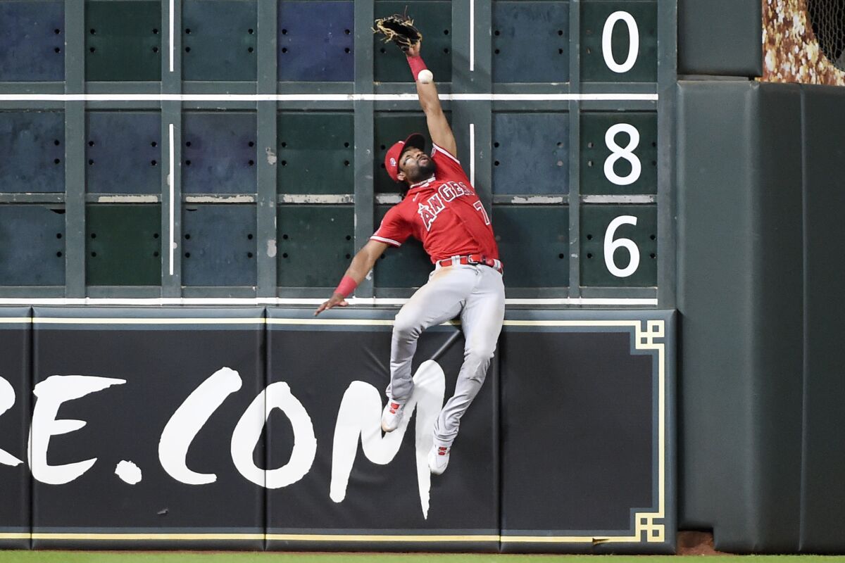 Jo Adell tries to make a leaping catch on Saturday. (AP Photo/Eric Christian Smith)