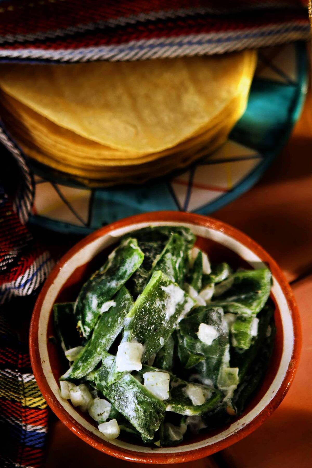 Rajas con crema is charred poblano pepper strips with cream.