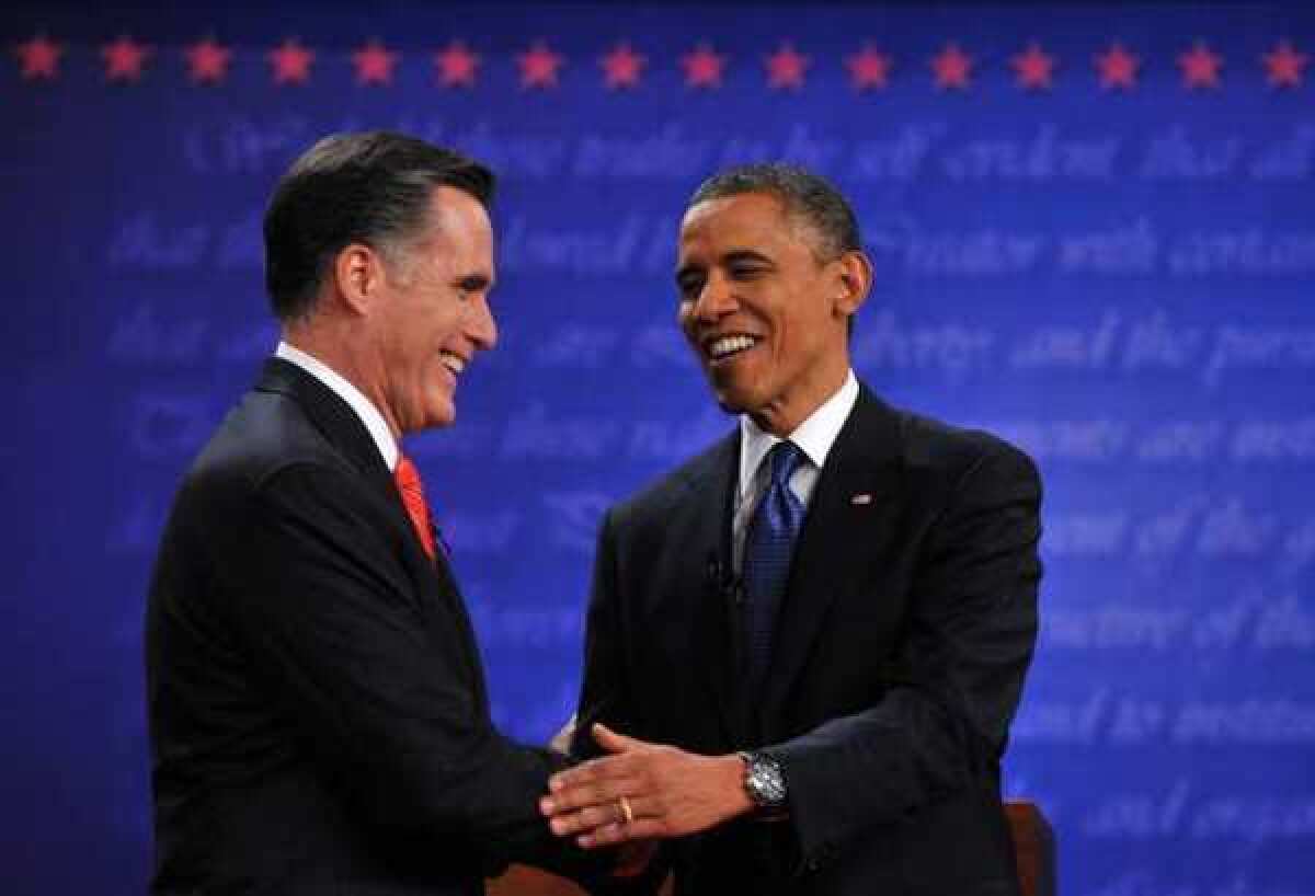 President Obama and Mitt Romney shake hands following their first debate at the University of Denver in Denver in Colorado on Oct. 3.