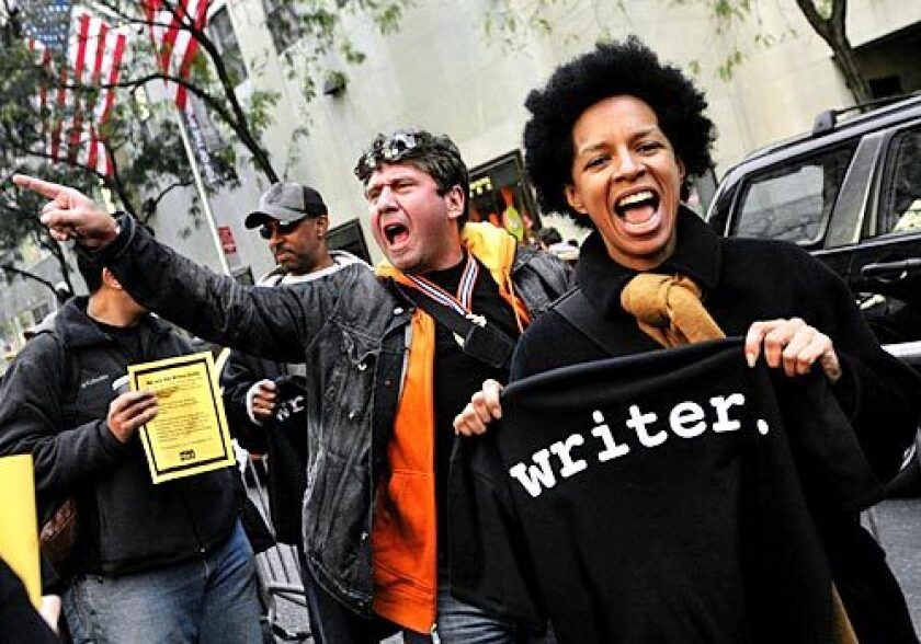 Seth Margolies and Elizabeth Hunter, members of the Writers Guild of America, picket NBC headquarters in New York during the last WGA strike in 2007.