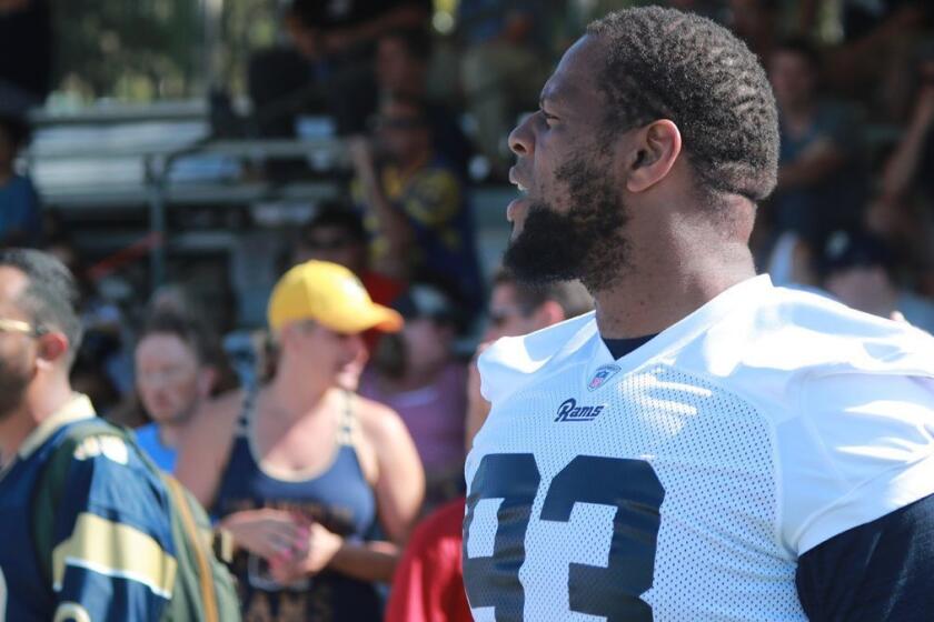 IRVINE, CALIF. -- MONDAY, AUGUST 13, 2018: Rams defensive tackle Ndamukong Suh watches practice at the Los Angeles Rams training camp at UC-Irvine in Irvine, Calif., on Aug. 13, 2018. (Allen J. Schaben / Los Angeles Times)