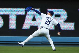 Los Angeles, CA - May 06:Los Angeles Dodger pitcher Walker Buehler warms up.