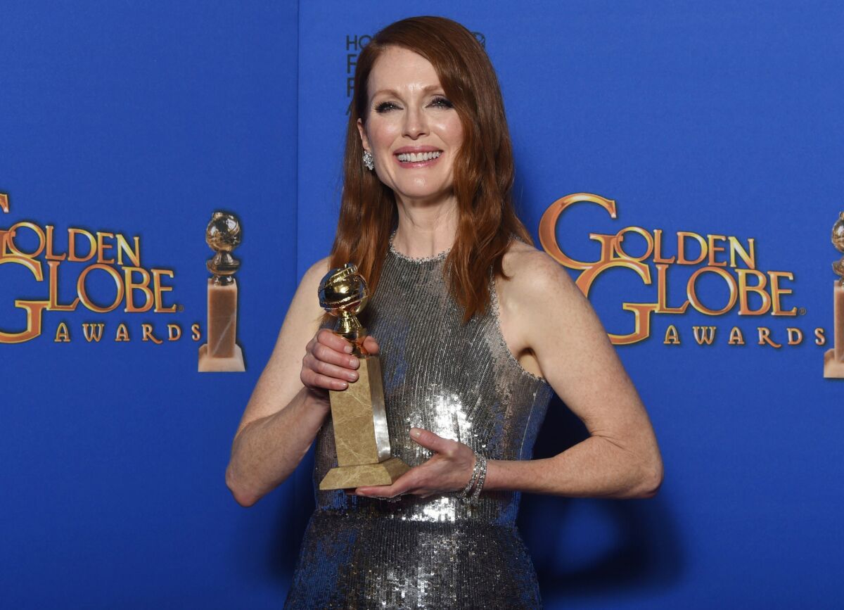 Julianne Moore poses with her Golden Globe award, which she won for her role in "Still Alice."