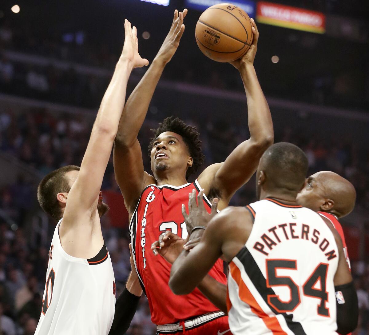 Portland Trail Blazers center Hassan Whiteside goes the basket against Clippers center Ivaca Zubac, left, and forward Patrick Patterson in the second quarter at Staples Center on Wednesday.