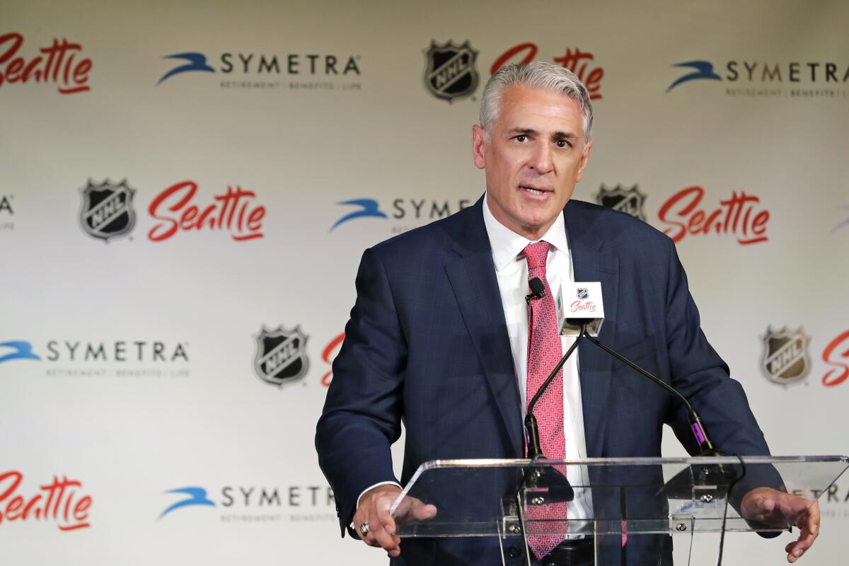 FILE - In this Thursday, July 18, 2019 file photo, Ron Francis talks to reporters in Seattle after he was introduced as the first general manager for Seattle's yet-to-be-named NHL hockey expansion team. Four years since George McPhee was a “puppet master” of the NHL leading up to the Vegas expansion draft, general managers approached this trade deadline with Seattle’s upcoming addition to the league in mind. While Kraken GM Ron Francis prepares – and maybe made a handshake deal or two already like McPhee did – Seattle was on his colleagues’ minds.(AP Photo/Ted S. Warren, File)