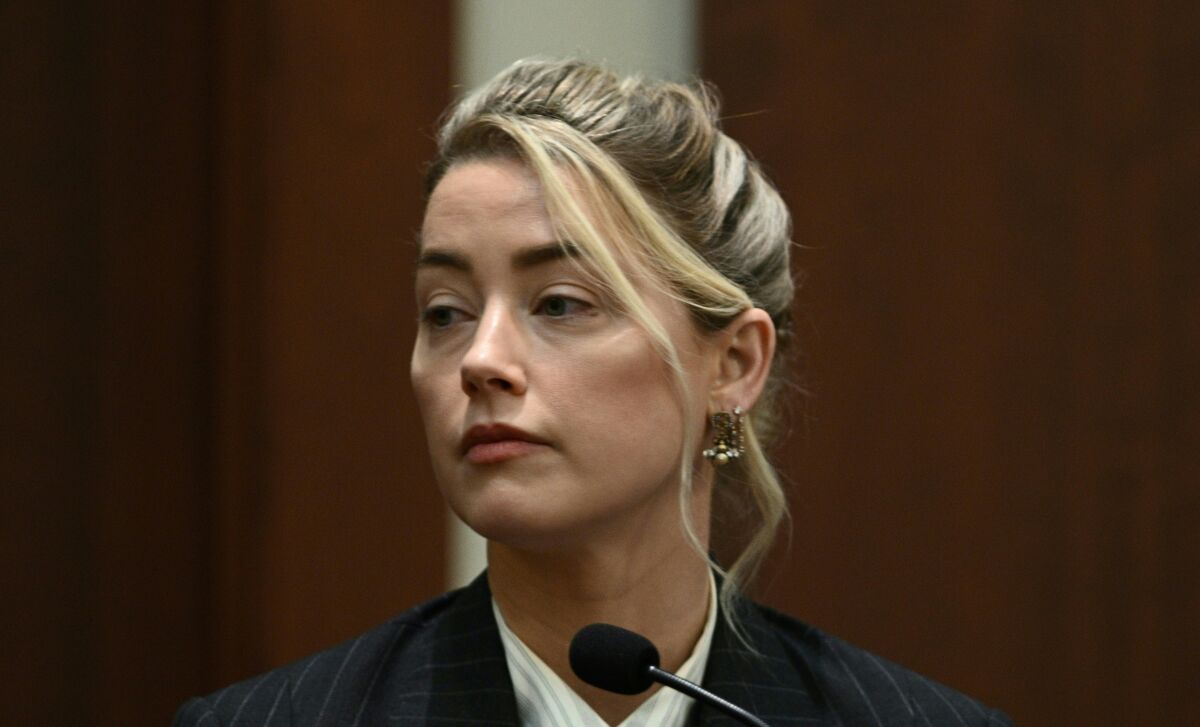 Actor Amber Heard testifies in the courtroom at the Fairfax County Circuit Courthouse in Fairfax, Va., Tuesday, May 17, 2022. Actor Johnny Depp sued his ex-wife Amber Heard for libel in Fairfax County Circuit Court after she wrote an op-ed piece in The Washington Post in 2018 referring to herself as a "public figure representing domestic abuse." (Brendan Smialowski/Pool photo via AP)