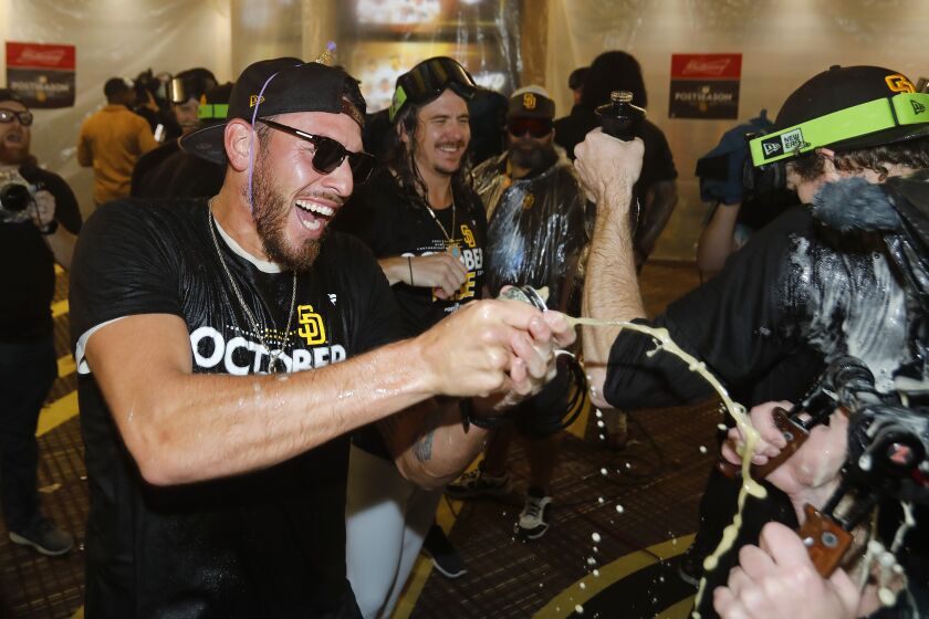 SAN DIEGO, CA - OCTOBER 2: San Diego Padres pitcher Joe Musgrove celebrates in the locker room after the team clinched a wildcard playoff spot at Petco Park on Sunday, October 2, 2022 in San Diego, CA. (K.C. Alfred / The San Diego Union-Tribune)