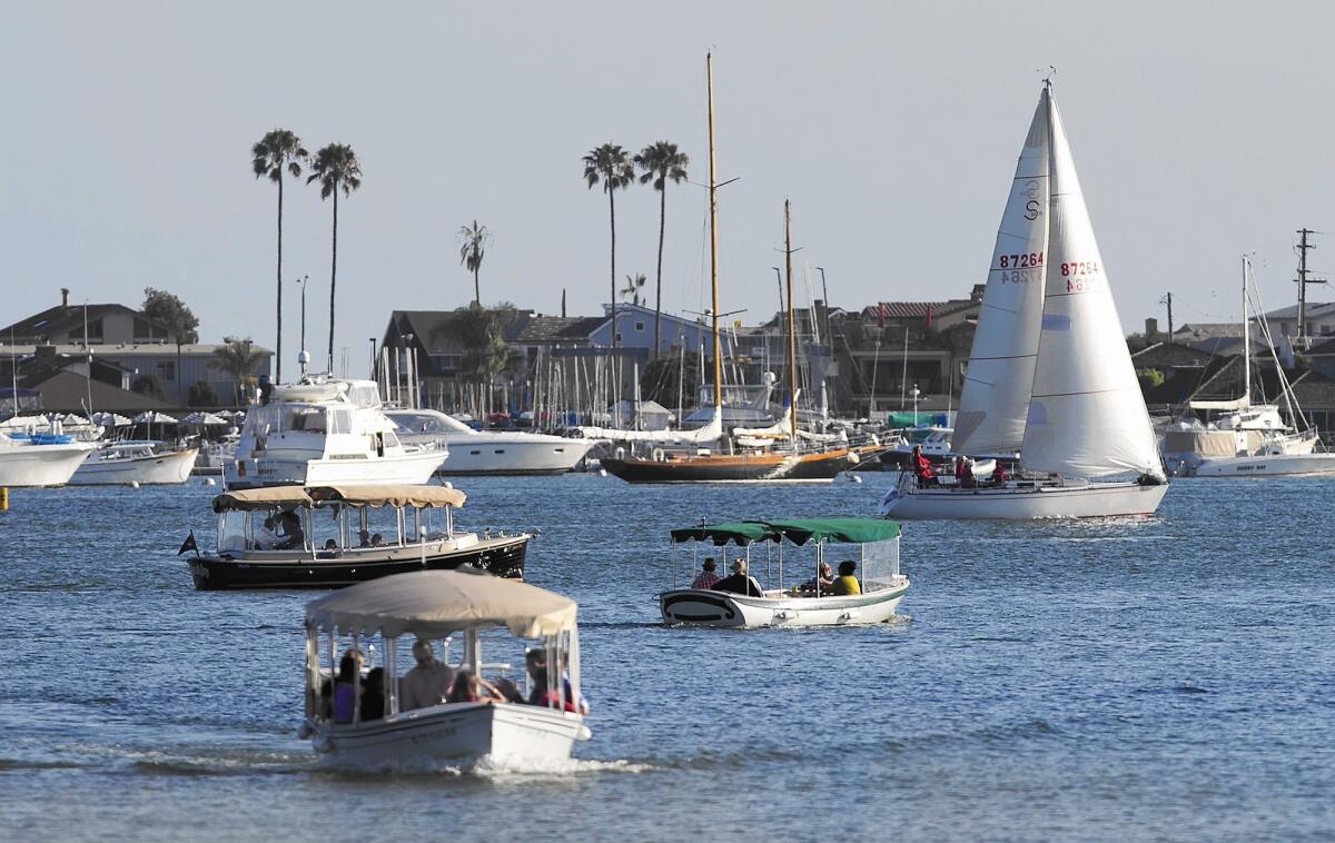 Boats move through the Newport Harbor turning basin, where a second public anchorage was given a trial from August to October.