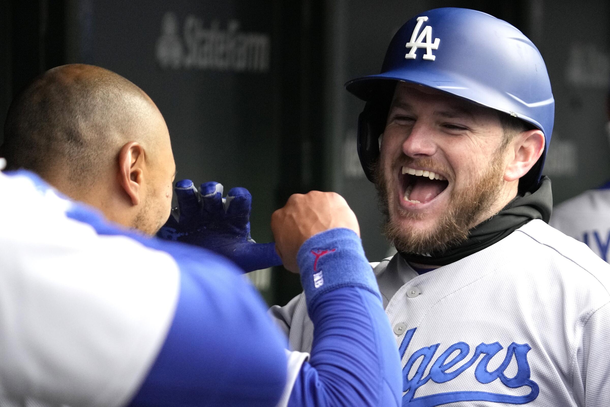Max Muncy, right, celebrates with Mookie Betts after hitting a two-run home run for the Dodgers against the Chicago Cubs.