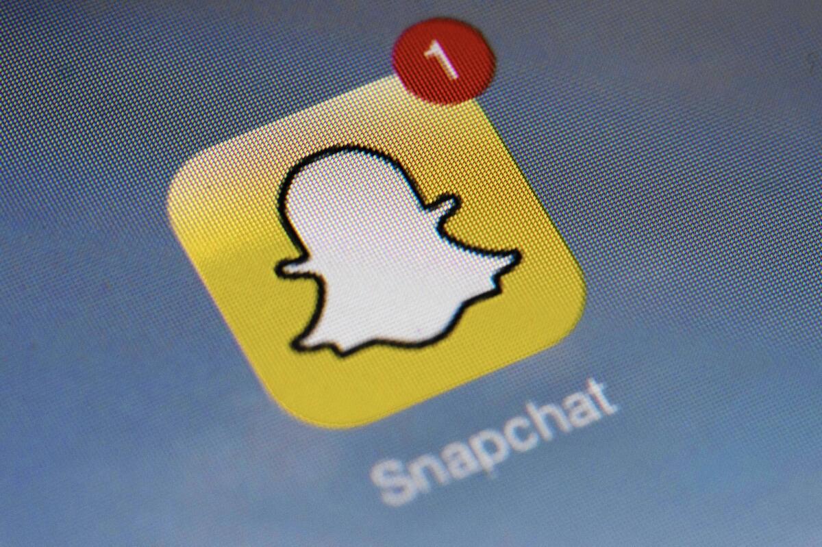 The Snapchat icon on a smartphone screen.