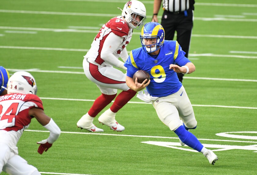 Rams quarterback John Wolford runs for a first down against the Arizona Cardinals.