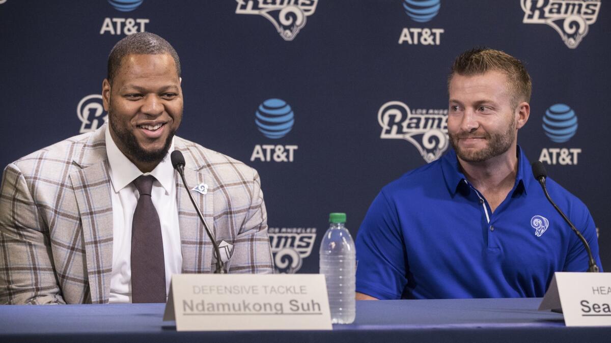 Rams Read coach Sean McVay, right, introduces new defensive tackle Ndamukong Suh in Thousand Oaks on Friday.