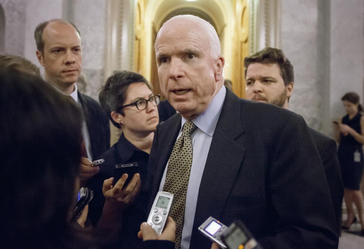 Sen. John McCain speaks to reporters on Capitol Hill in November.