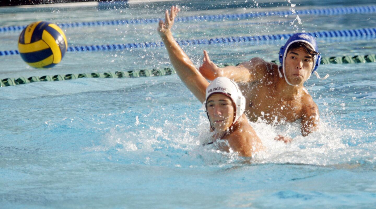 Burbank's Shane Pentkowski, top, tries to make a shot while Arlintgon's Chris Andra defends Pentkowski during the CIF Southern Section Division V playoffs at Burbank High School on Thursday, November 7, 2012.
