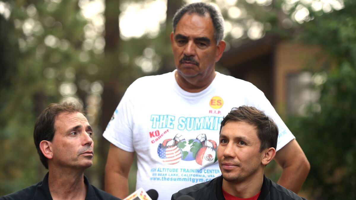 Gennady Golovkin speaks to the media as he is joined by promoter Tom Loeffler, left, and trainer Abel Sanchez, rear, during a press conference at The Summitt on Aug. 9 in Big Bear Lake.