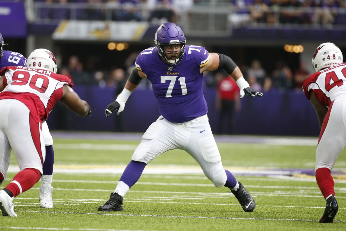 FILE - Minnesota Vikings offensive tackle Riley Reiff (71) looks to make a block during the first half of an NFL preseason football game against the Arizona Cardinals, Saturday, Aug. 24, 2019, in Minneapolis. Minnesota's offensive line remains a work in progress, but the Vikings have a trusted teacher to follow in Rick Dennison. (AP Photo/Bruce Kluckhohn, File)