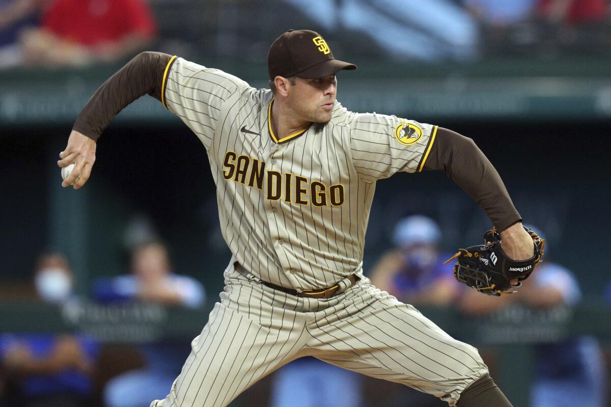 Padres pitcher Craig Stammen throws in the first inning after replacing starting pitcher Adrian Morejon.