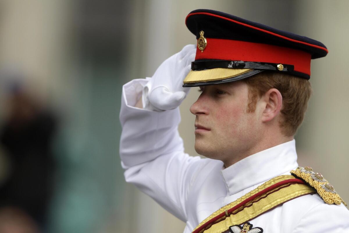 Prince Harry will end his active military service in June. The British royal is shown on May 16, 2014, saluting the guards during a wreath-laying ceremony at the Monument to the War of Independence in Freedom Square in Tallinn, Estonia.