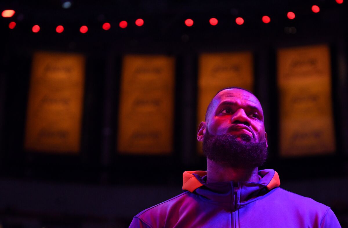 Lakers star LeBron James stands on the court before a game against the Clippers at Crypto.com Arena.