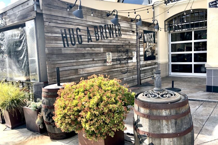 Karl Strauss Brewing Co. in La Jolla may need to revise its "Hug a Brewer" motto with the new emphasis on social distancing.