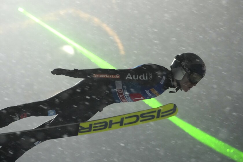 Germany's Andreas Wellinger soars through the air during the third stage of the 70th Four Hills ski jumping tournament in Bischofshofen, Austria, Wednesday, Jan. 5, 2022. (AP Photo/Matthias Schrader)
