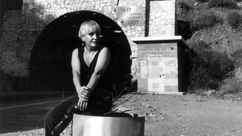 A 1991 photo of artist Lynne Westmore Bloom at the tunnel in Malibu, where she painted the "Pink Lady," a piece of guerrilla public art, in 1966.