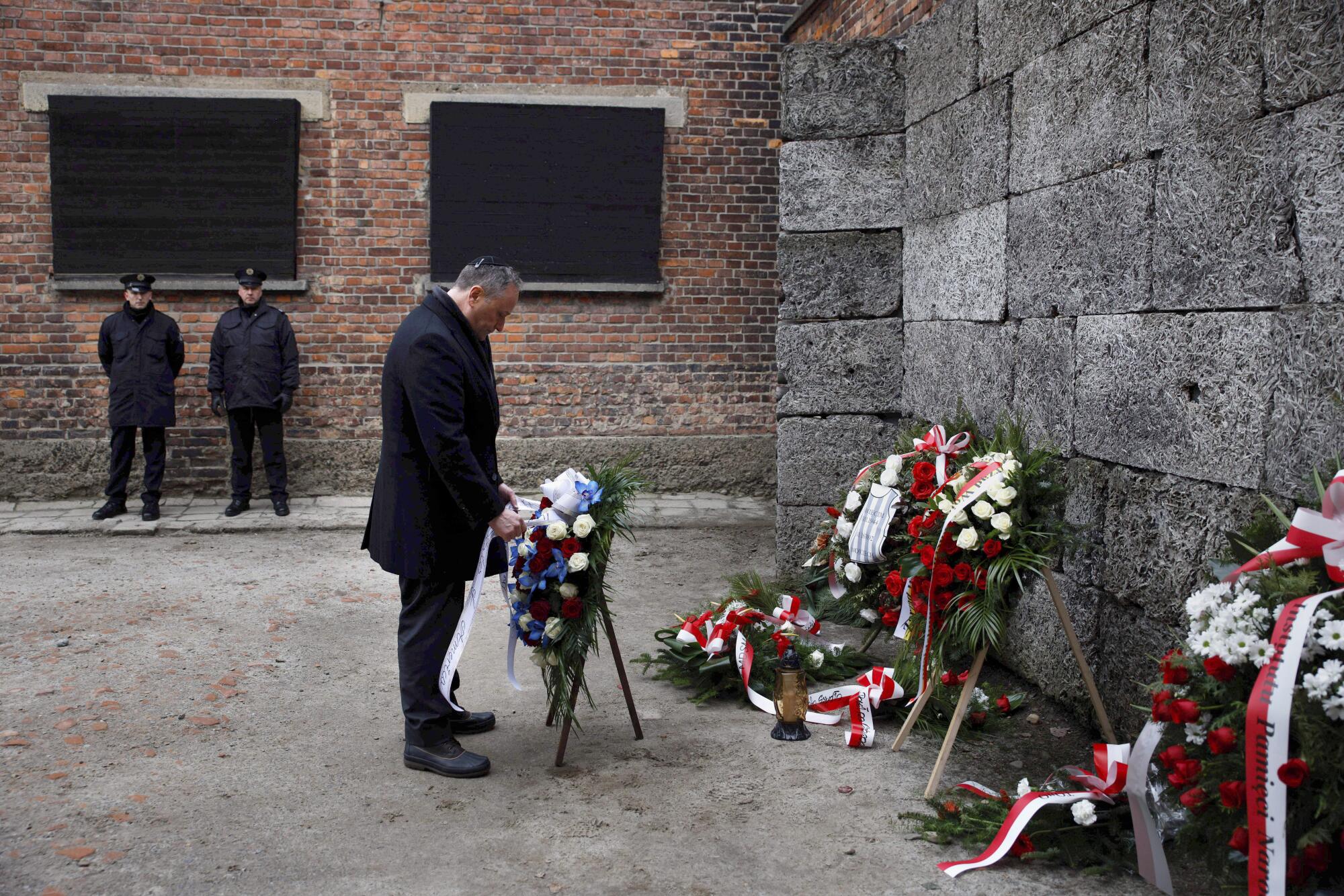 Second Gentleman Douglas Emhoff lays a wreath during his visit to the former Nazi German concentration camp.