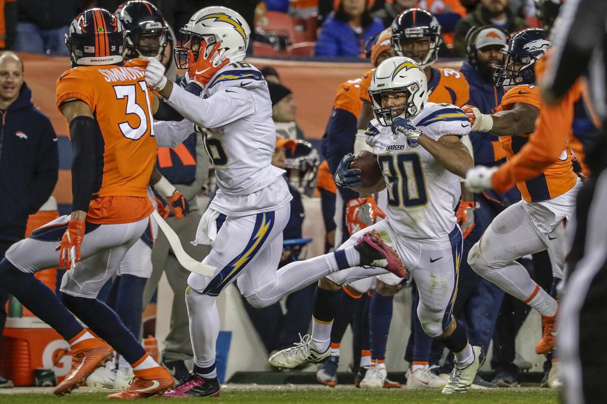 Chargers running back Austin Ekeler makes a cut for a 41-yard run in the fourth quarter against the Broncos.