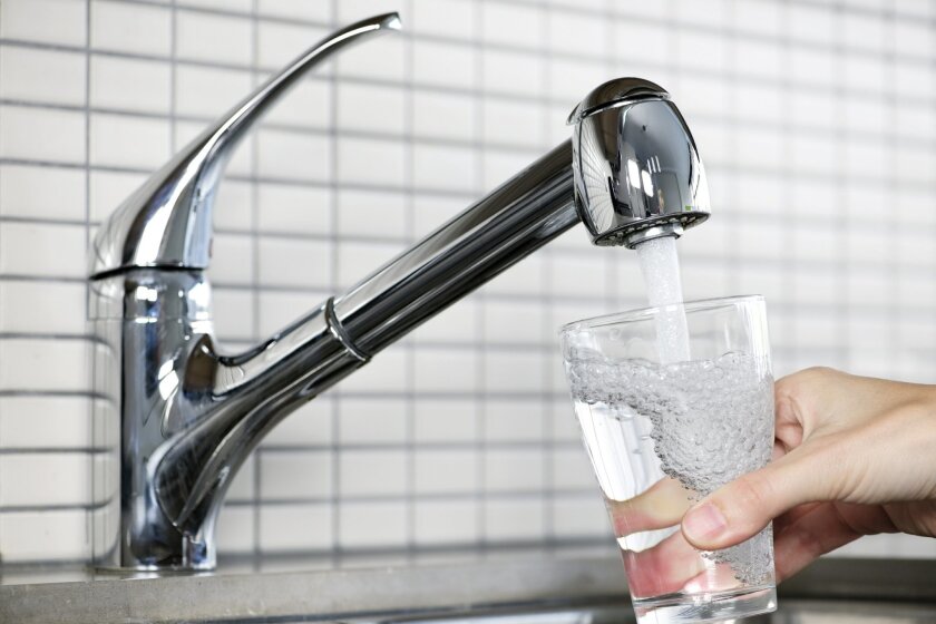 A water tap filling a glass of water. The San Diego County Water Authority received a state citation for a failure at its Twin Oaks Valley Water Treatment Plant in North County.