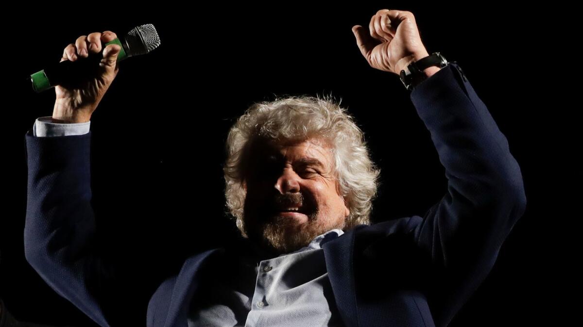 Beppe Grillo, leader of the Five Stars Movement party, attends a rally on the upcoming constitutional reforms referendum in Rome on Nov. 26, 2016.