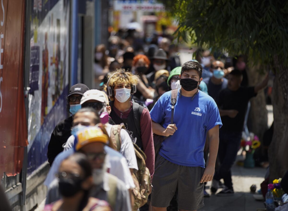 Transborder commuters in Tijuana wait to cross into the U.S. in San Ysidro.