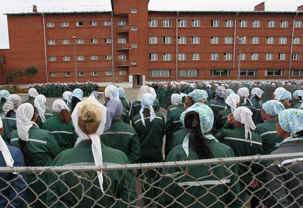 Women incarcerated at a prison in Sarapul, Russia, stand during morning inspection on Aug. 22, 2012.