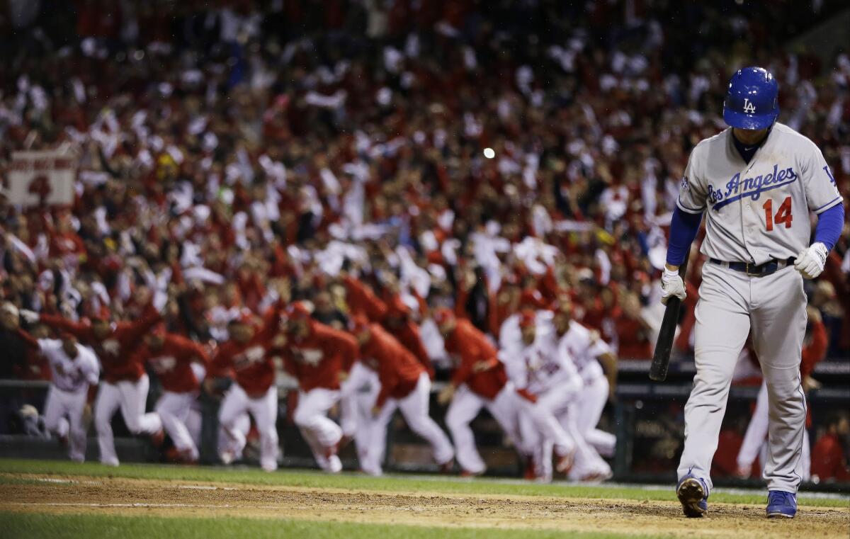 Dodgers' Mark Ellis walks away after striking out to end Game 6 of the 2013 NLCS against the St. Louis Cardinals.