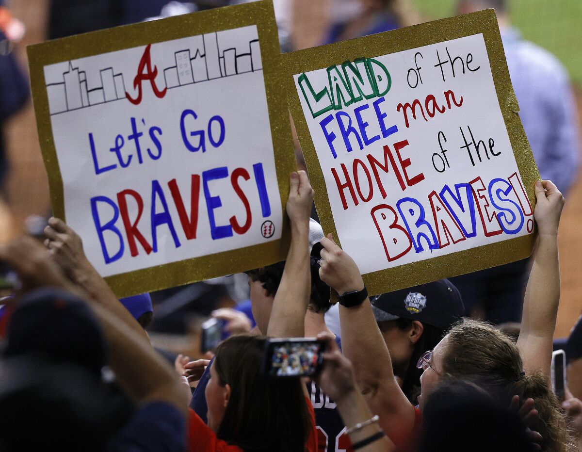 Atlanta Braves fans celebrates after their team won the World Series against the Houston Astros on Tuesday, Nov. 2, 2021 at Minute Maid Park. (Kevin M. Cox/The Galveston County Daily News via AP)