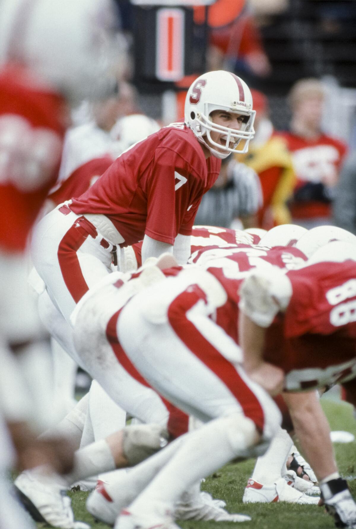 John Elway of the Stanford Cardinal calls signals during an NCAA Pac-10 football game against the Washington Huskies