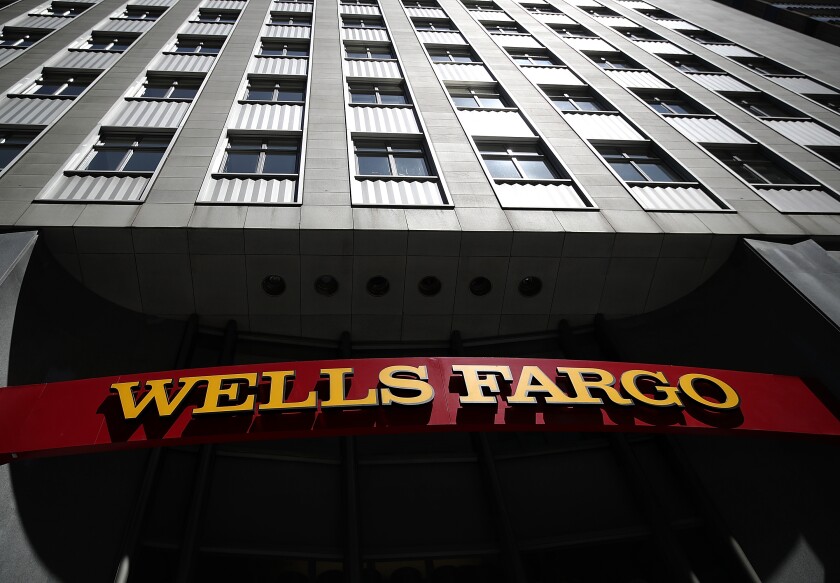 A Wells Fargo sign in front of a building.