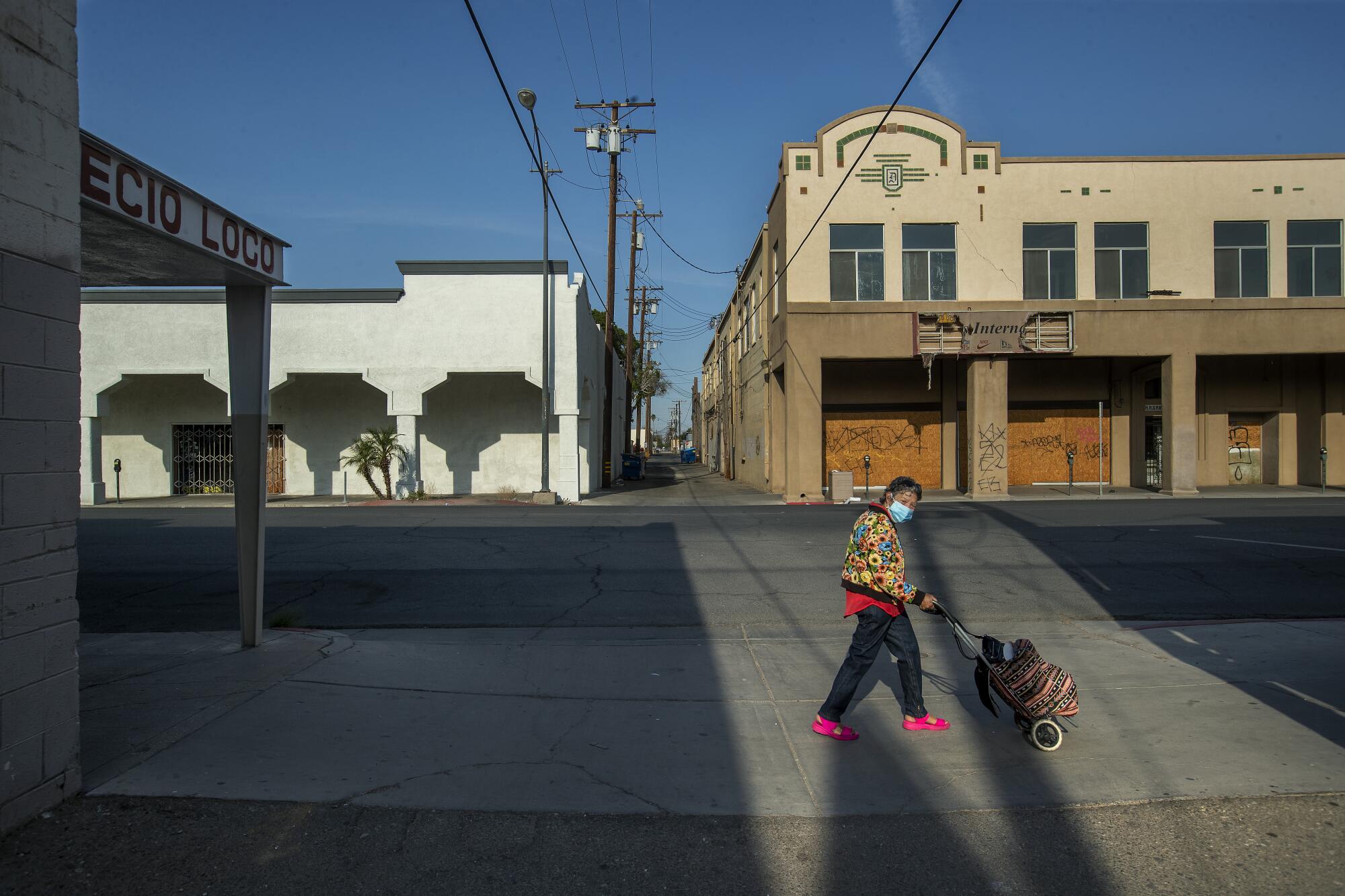 A pedestrian walks in downtown Calexico.